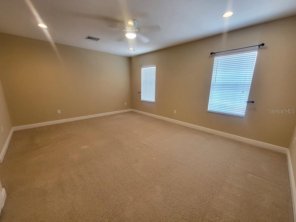 10418 Fenceline Road New Port Richey, FL 34655 - Photo 19 of 36 an empty room with windows