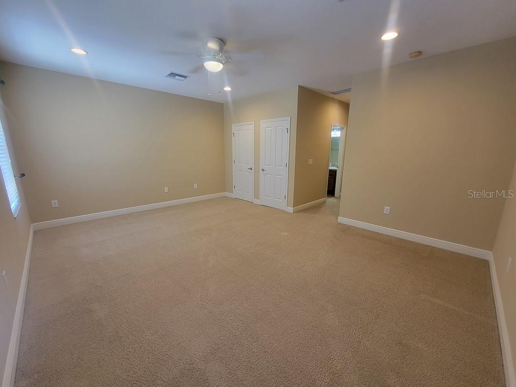 10418 Fenceline Road New Port Richey, FL 34655 - Photo 20 of 36 an empty room with an entryway