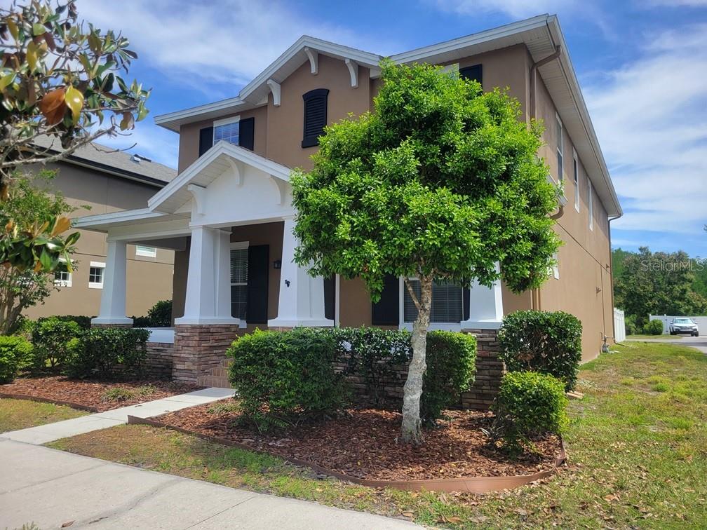 10418 Fenceline Road New Port Richey, FL 34655 - Photo 2 of 36 a front view of a house with garden