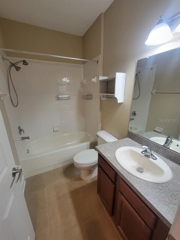 10418 Fenceline Road New Port Richey, FL 34655 - Photo 22 of 36 a bathroom with a granite countertop sink toilet and shower