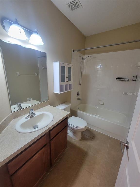 10418 Fenceline Road New Port Richey, FL 34655 - Photo 30 of 36 a bathroom with a sink a toilet and shower