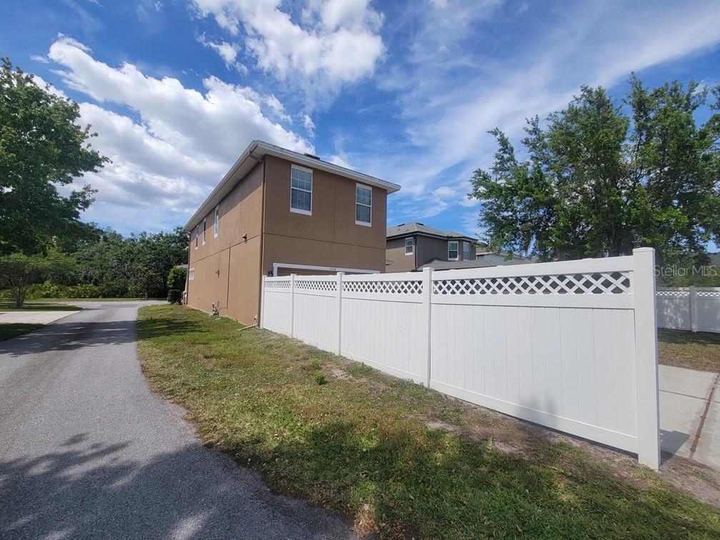 10418 Fenceline Road New Port Richey, FL 34655 - Photo 35 of 36 a house view with a backyard