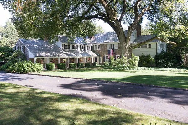 a front view of a house with a yard