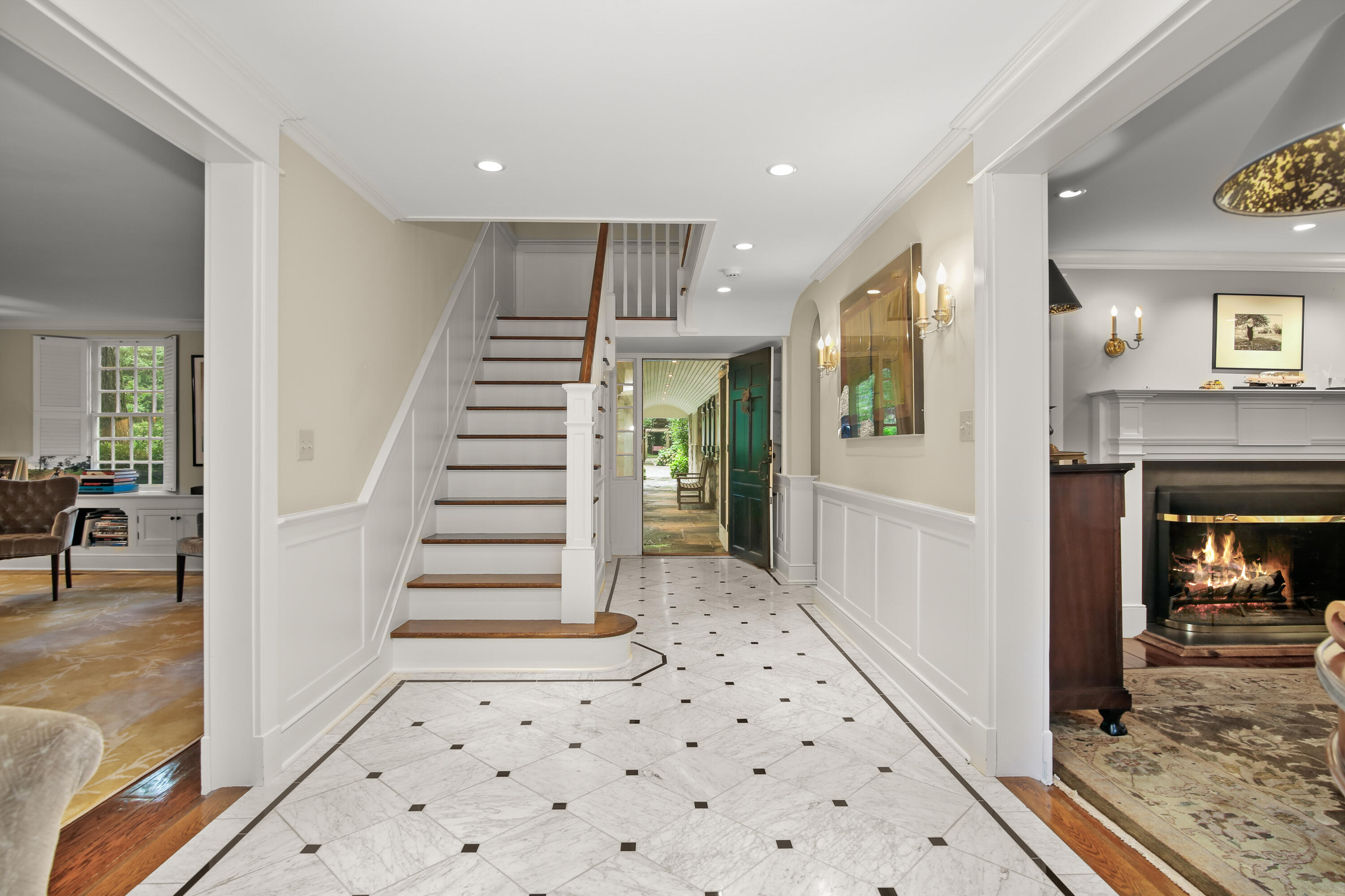 114 Ferris Hill Road New Canaan, CT 06840 - Photo 11 of 58 a view of a hallway view with staircase and kitchen view