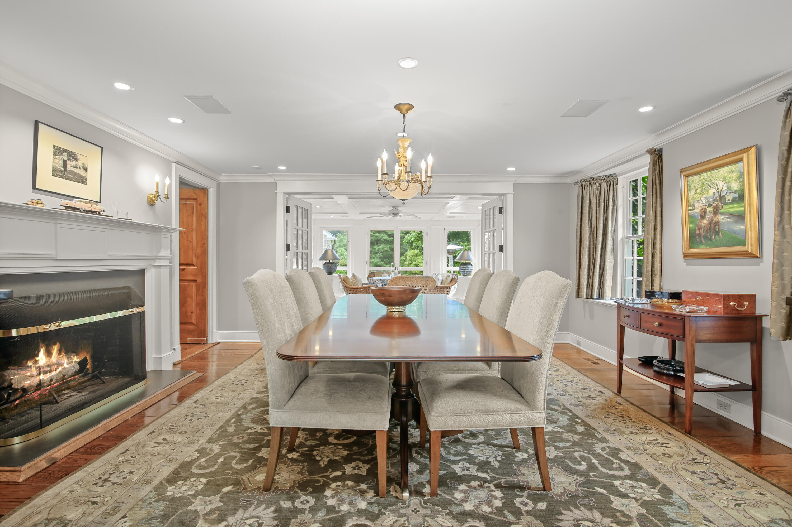 114 Ferris Hill Road New Canaan, CT 06840 - Photo 15 of 58 a dining room with furniture a chandelier and wooden floor