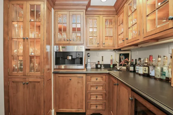 a large kitchen with a table and chairs