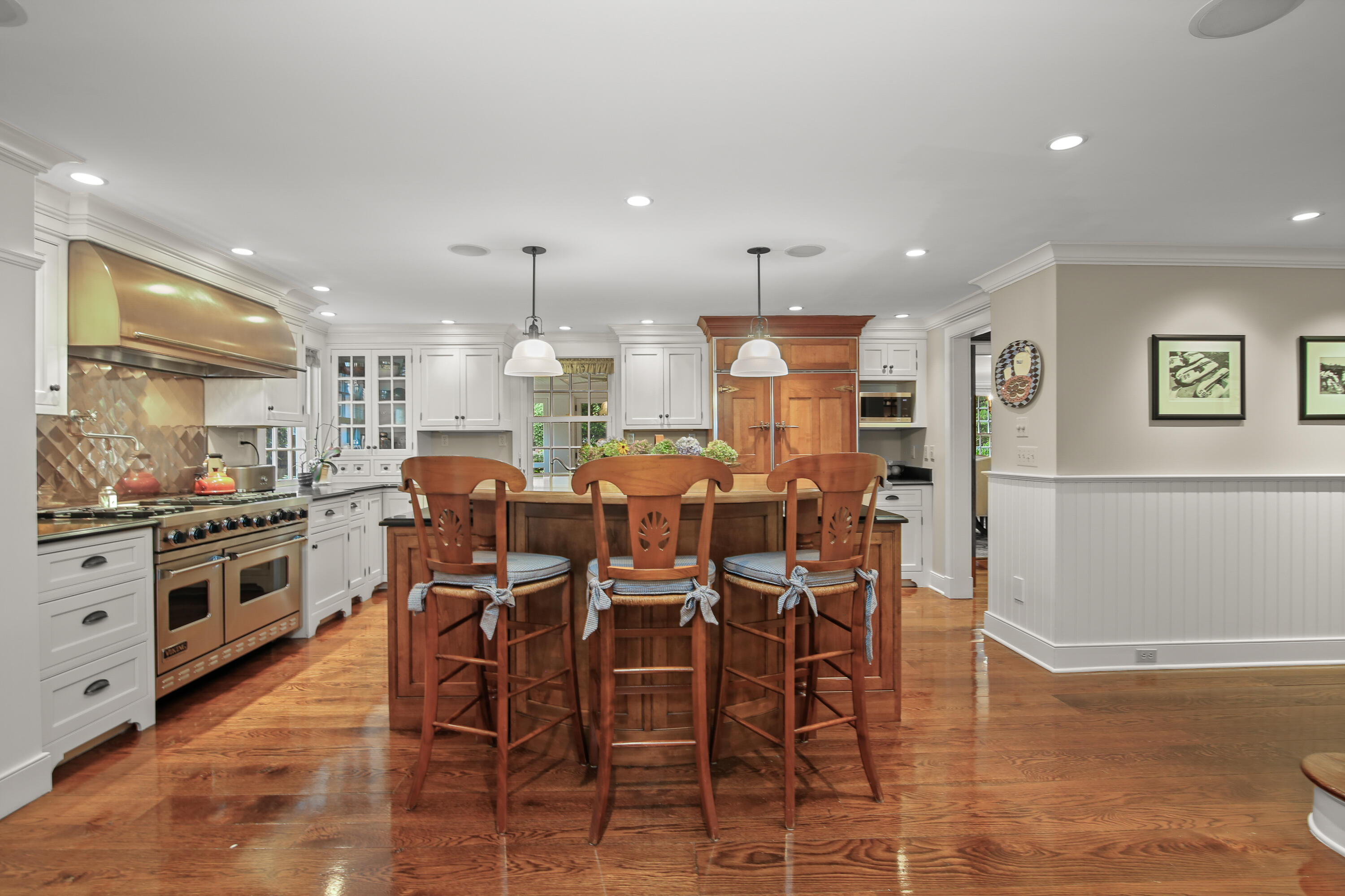 114 Ferris Hill Road New Canaan, CT 06840 - Photo 21 of 58 a large kitchen with a table and chairs