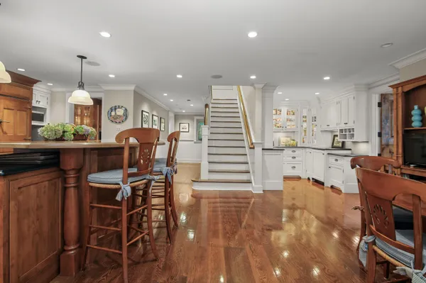 a view of a dining room with furniture window and wooden floor