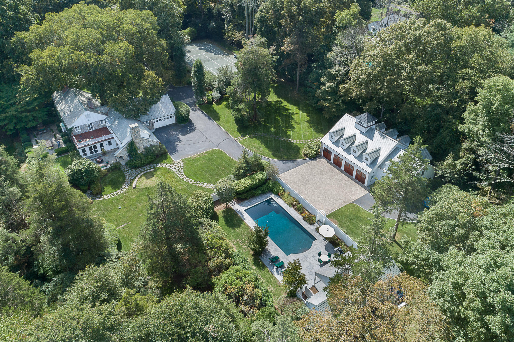 114 Ferris Hill Road New Canaan, CT 06840 - Photo 3 of 58 an aerial view of a house with a yard and outdoor seating