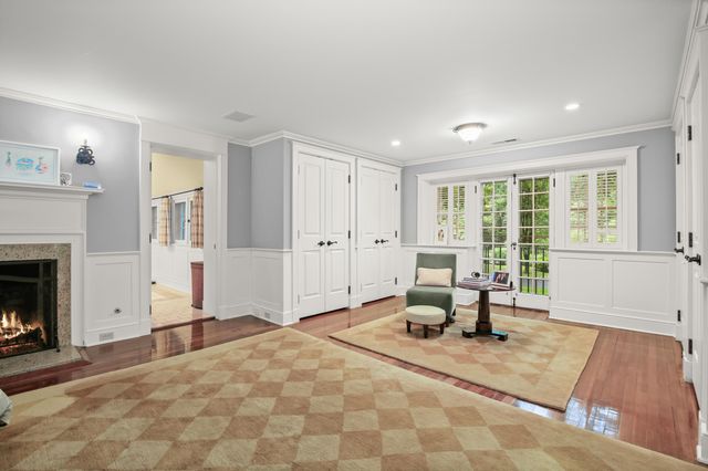 a living room with furniture a window and a table