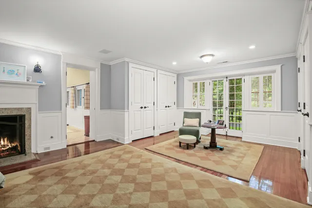 a living room with furniture a window and a table