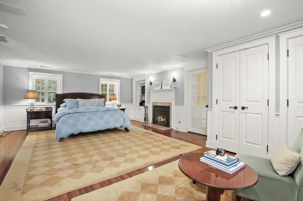 a living room with a large window and a table