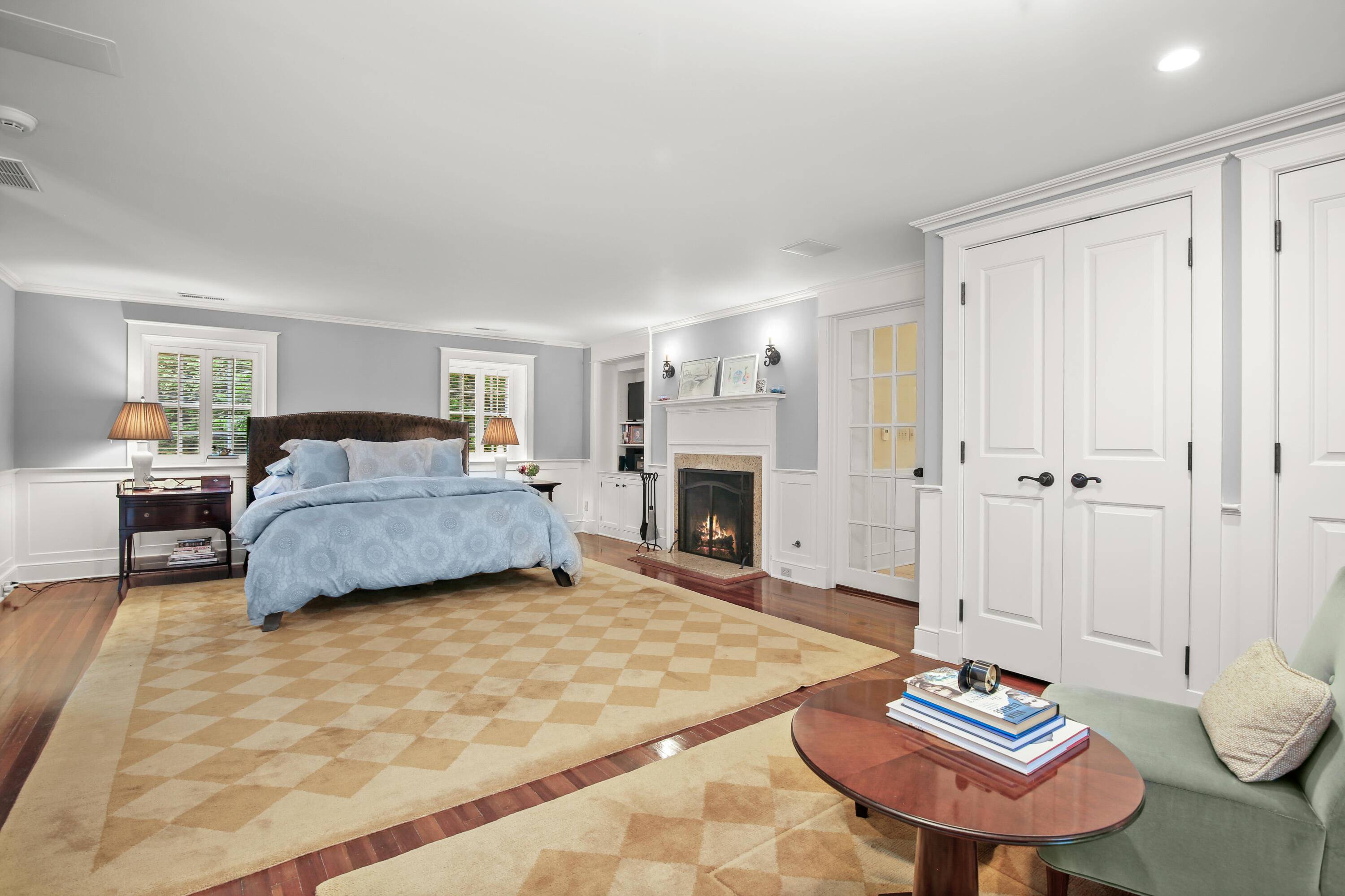 114 Ferris Hill Road New Canaan, CT 06840 - Photo 35 of 58 a bedroom with a bed and a chair