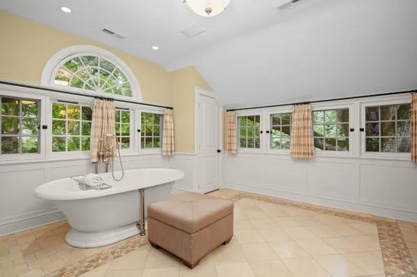 a bathroom with a sink toilet a mirror and shower