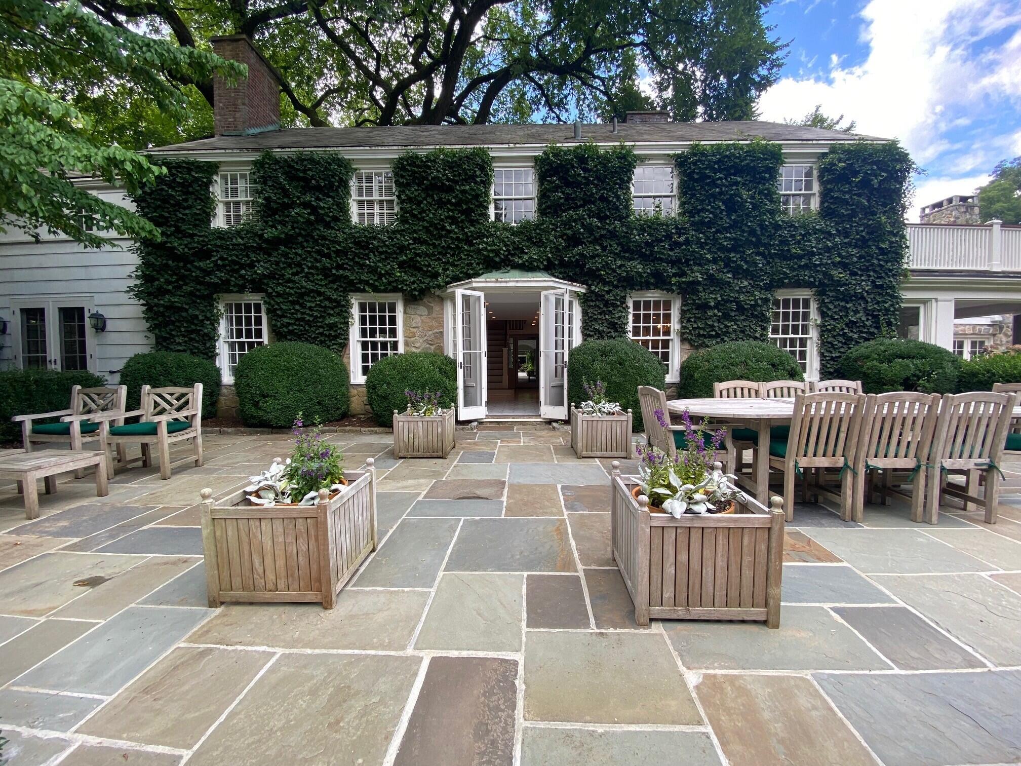 114 Ferris Hill Road New Canaan, CT 06840 - Photo 4 of 58 a view of a patio with couches table and chairs and potted plants