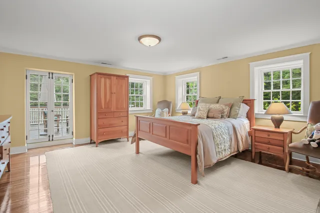 a spacious bedroom with a bed and a window