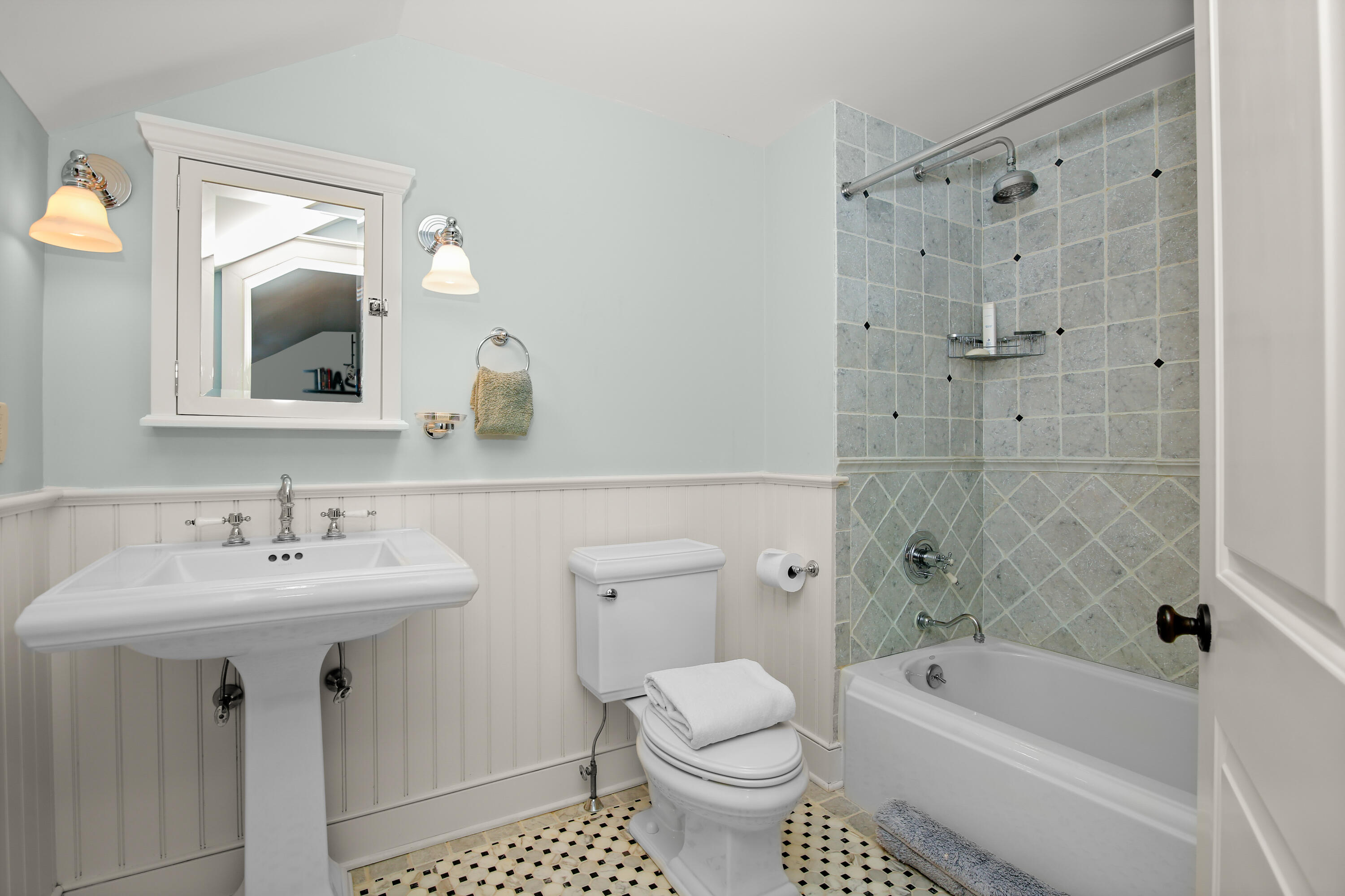 114 Ferris Hill Road New Canaan, CT 06840 - Photo 44 of 58 a bathroom with a sink toilet a mirror and shower