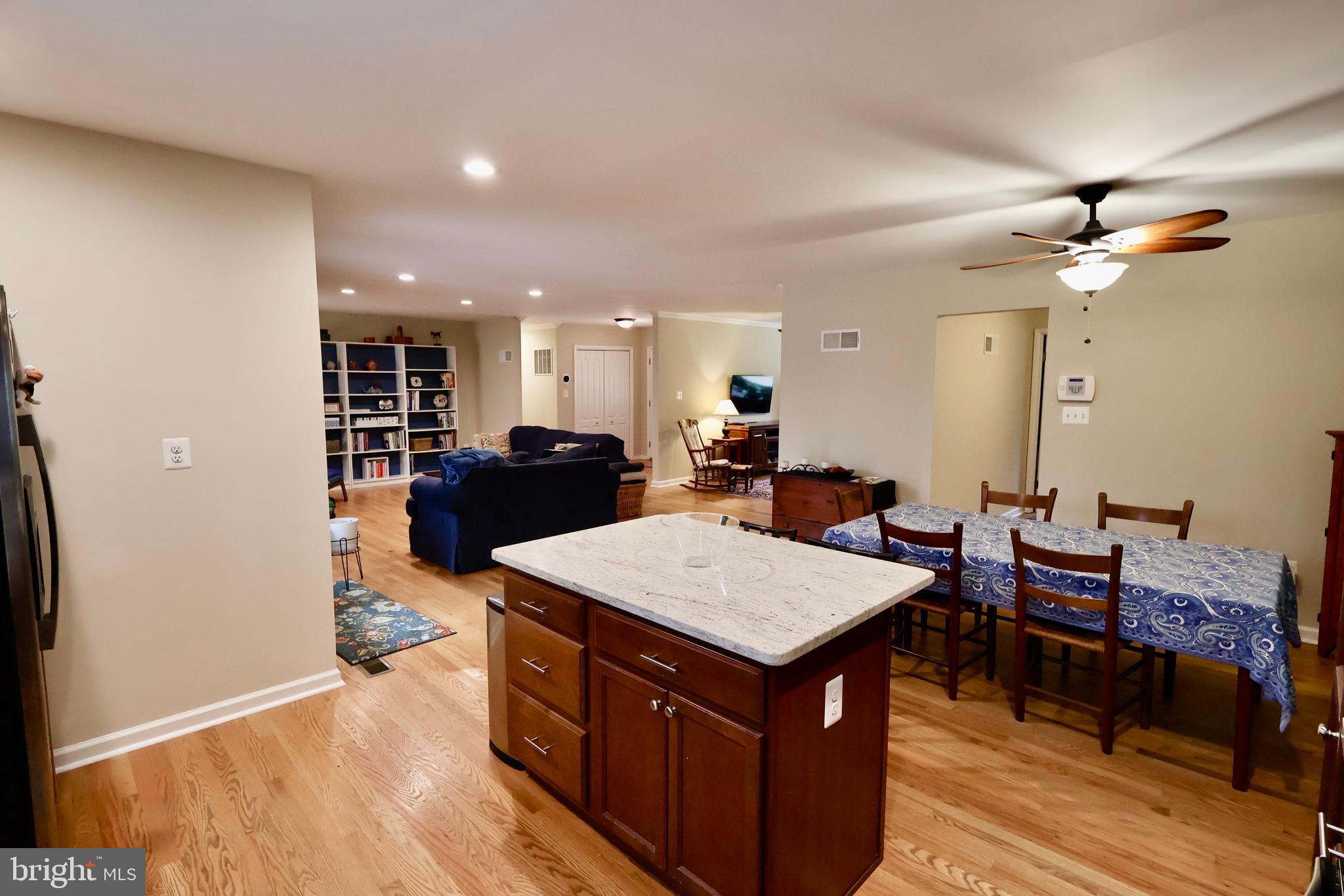13040 Wainwright Road Highland, MD 20777 - Photo 17 of 34 a large kitchen with a table and chairs