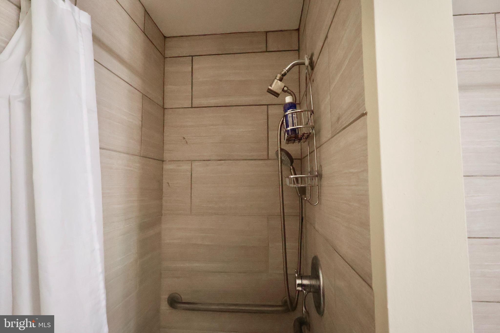 13040 Wainwright Road Highland, MD 20777 - Photo 25 of 34 a bathroom with a shower