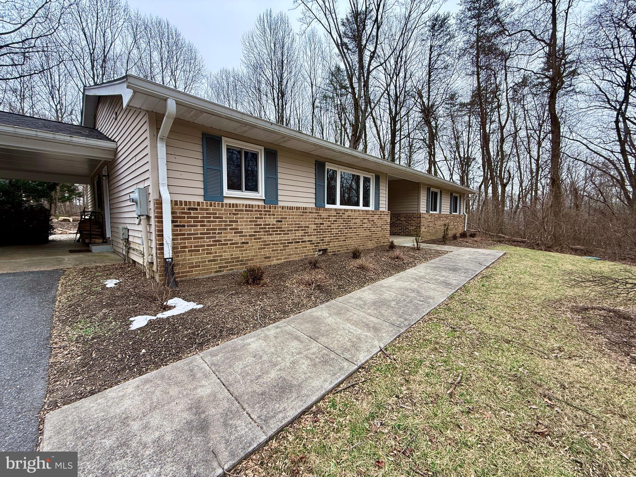 13040 Wainwright Road Highland, MD 20777 - Photo 8 of 34 a front view of a house with yard
