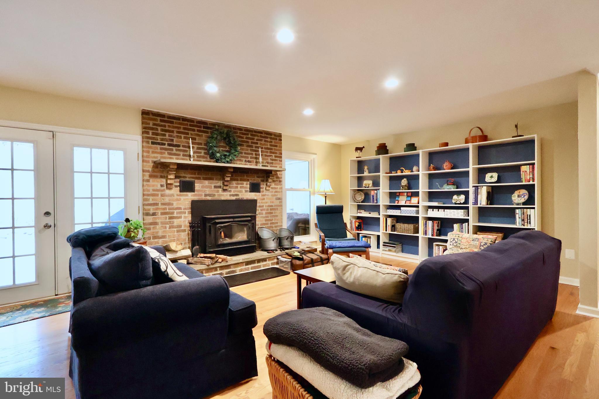13040 Wainwright Road Highland, MD 20777 - Photo 10 of 34 a living room with furniture and a fireplace