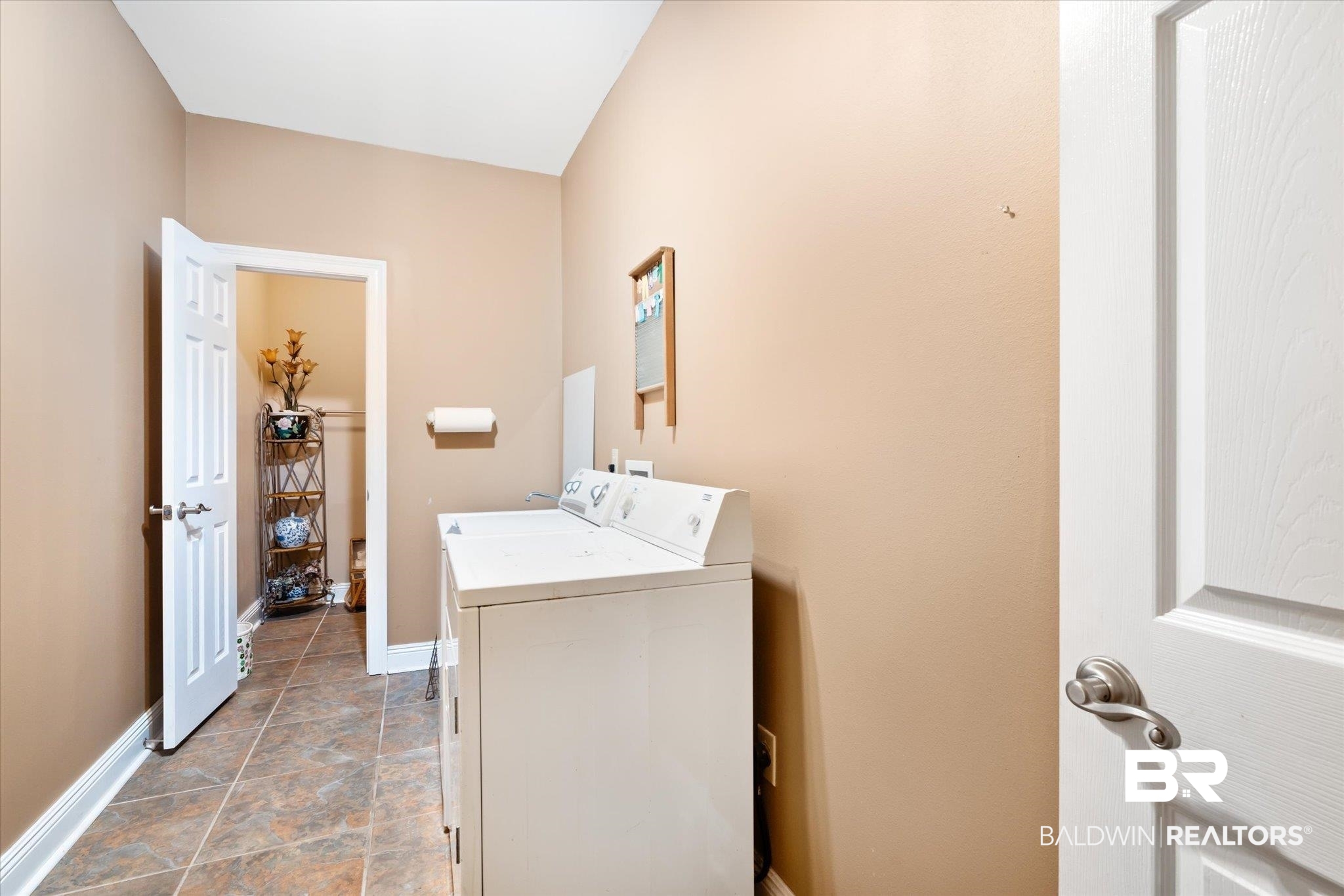 2400 Waterford Road Semmes, AL 36575 - Photo 23 of 30 Laundry area with independent washer and dryer and baseboards