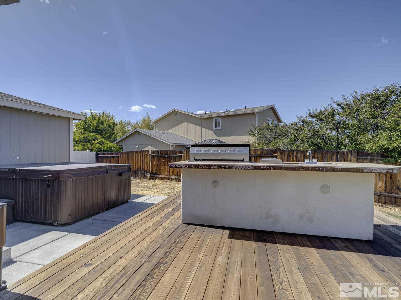 17175 Waxwing Street Reno, NV 89508 - Photo 6 of 25 a view of balcony with wooden floor and a potted plant