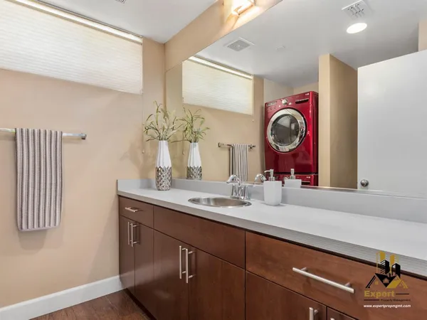 a bathroom with a sink and a mirror