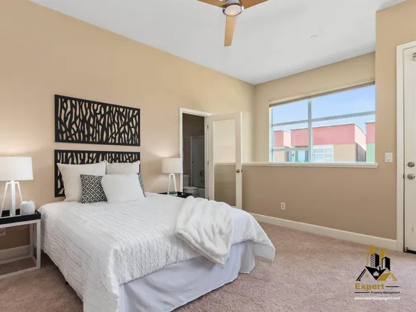a bedroom with a bed and window