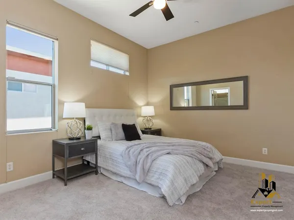 a bedroom with a bed and window