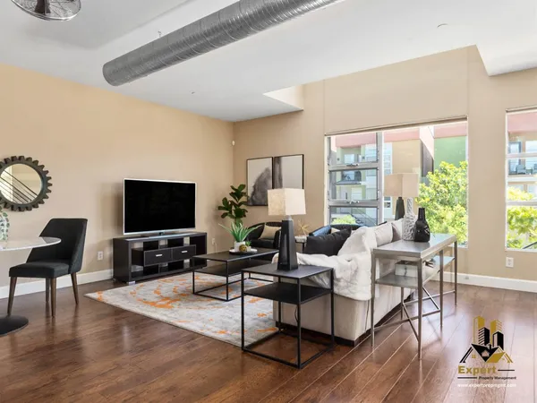 a living room with furniture and a flat screen tv