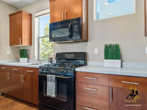 a kitchen with a stove and a microwave