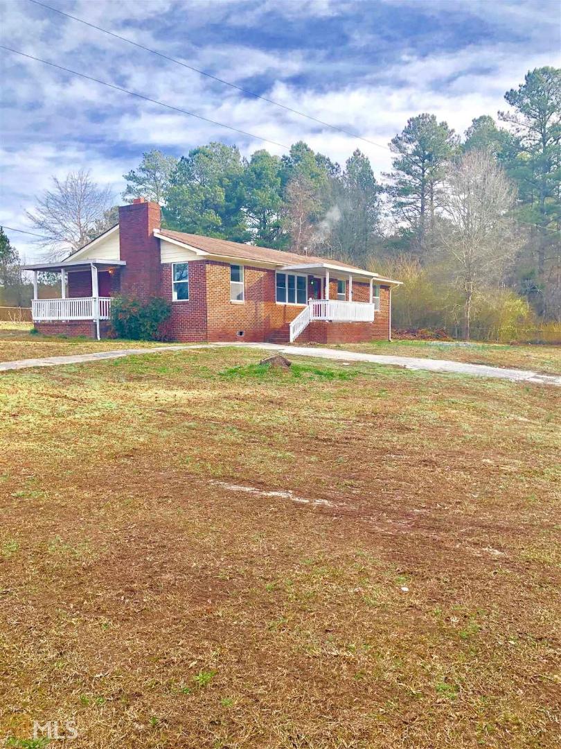 18 Stapler Road Newnan, GA 30263 - Photo 1 of 1 a front view of a house with a yard