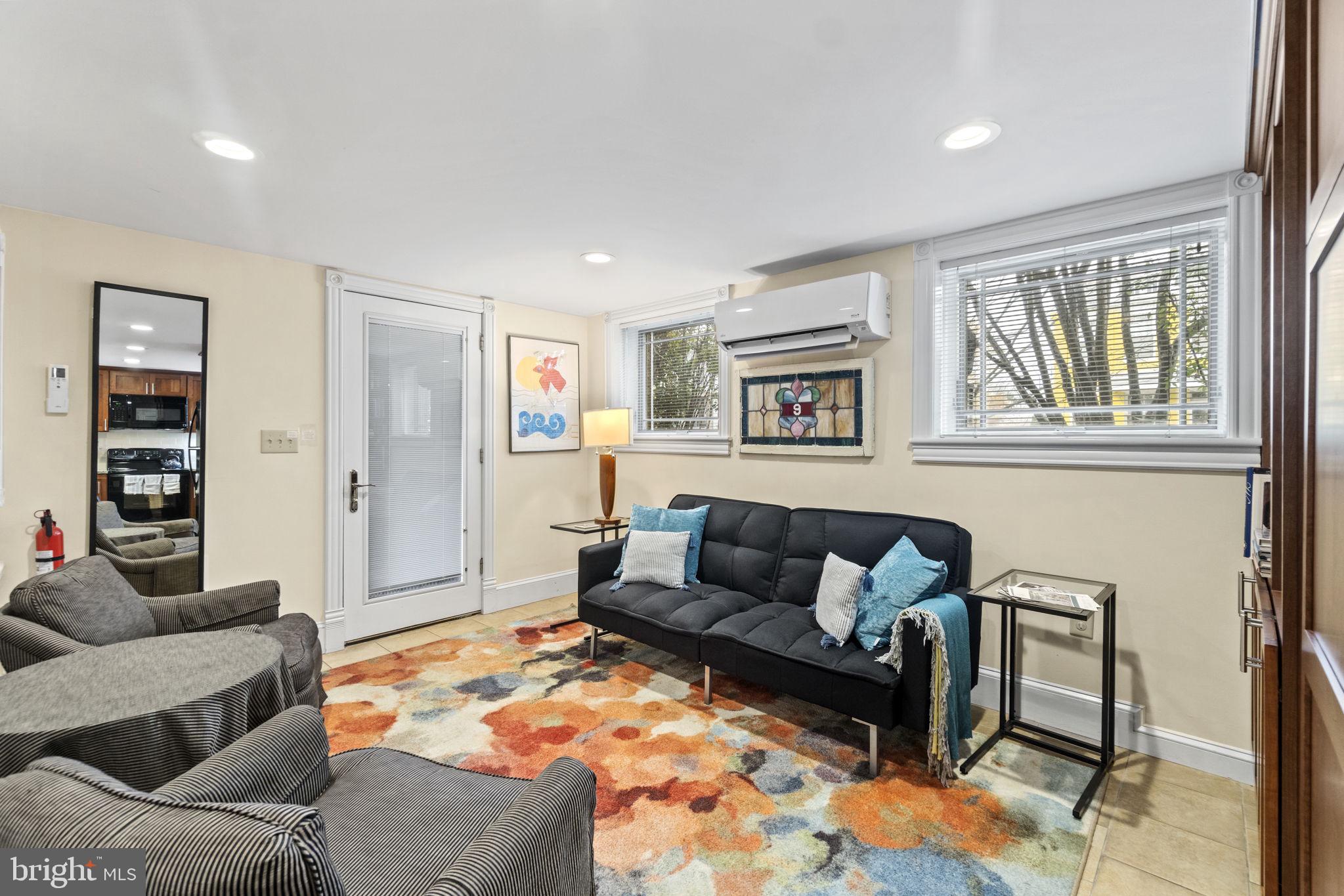 1100 E Street Northeast Washington, DC 20002 - Photo 51 of 66 AirB&B living room complete w/ conveying TV