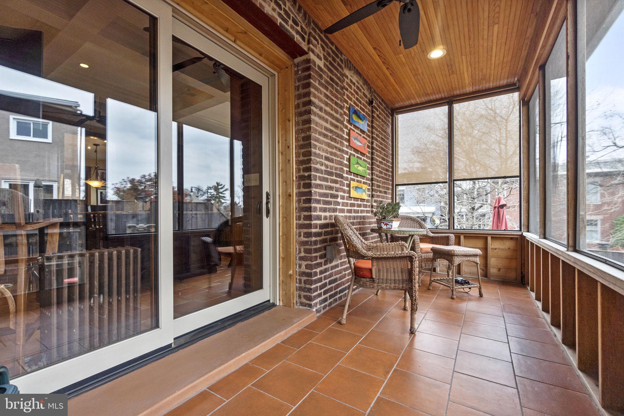 1100 E Street Northeast Washington, DC 20002 - Photo 60 of 66 Tiled,screened,w/ shades leads to wow patio