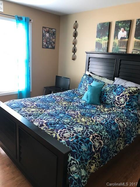 3510 Mack Ballard Road, Unit 13 Maiden, NC 28650 - Photo 11 of 24 a bed sitting in a bedroom next to a window