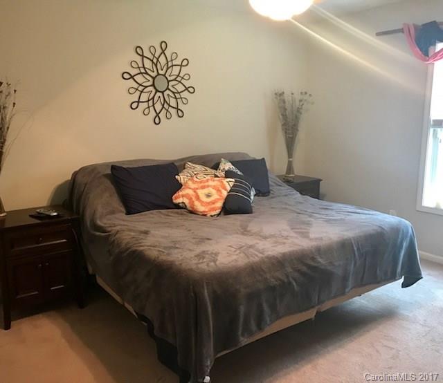 3510 Mack Ballard Road, Unit 13 Maiden, NC 28650 - Photo 12 of 24 a bedroom with a bed and dresser