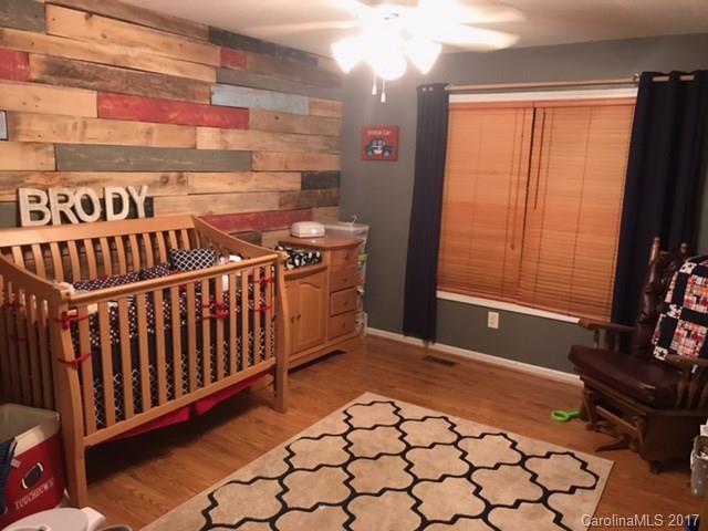 3510 Mack Ballard Road, Unit 13 Maiden, NC 28650 - Photo 17 of 24 a view of a room with racks on the wall