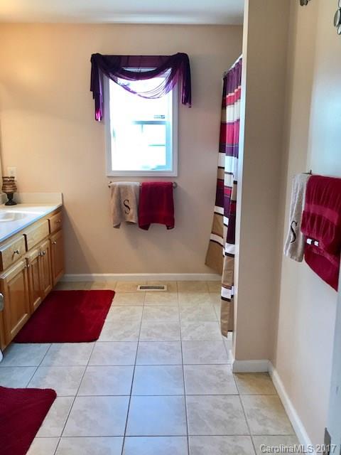3510 Mack Ballard Road, Unit 13 Maiden, NC 28650 - Photo 18 of 24 a kitchen with a cabinets and window