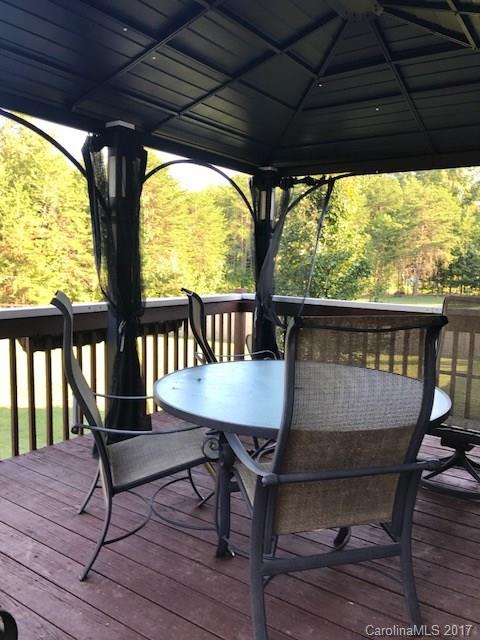 3510 Mack Ballard Road, Unit 13 Maiden, NC 28650 - Photo 19 of 24 a view of a porch with furniture and wooden floor