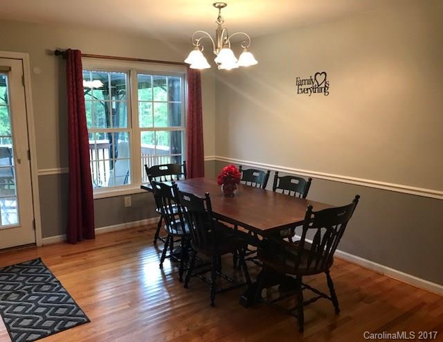 3510 Mack Ballard Road, Unit 13 Maiden, NC 28650 - Photo 6 of 24 a view of a dining room with furniture window and wooden floor