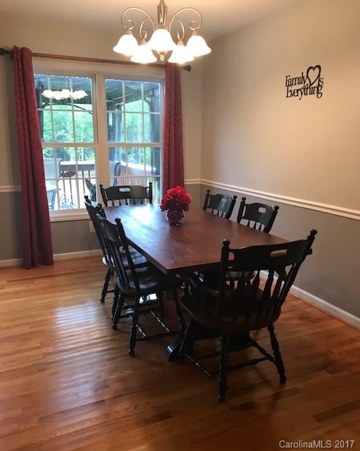 3510 Mack Ballard Road, Unit 13 Maiden, NC 28650 - Photo 7 of 24 a view of a dining room with furniture window and wooden floor