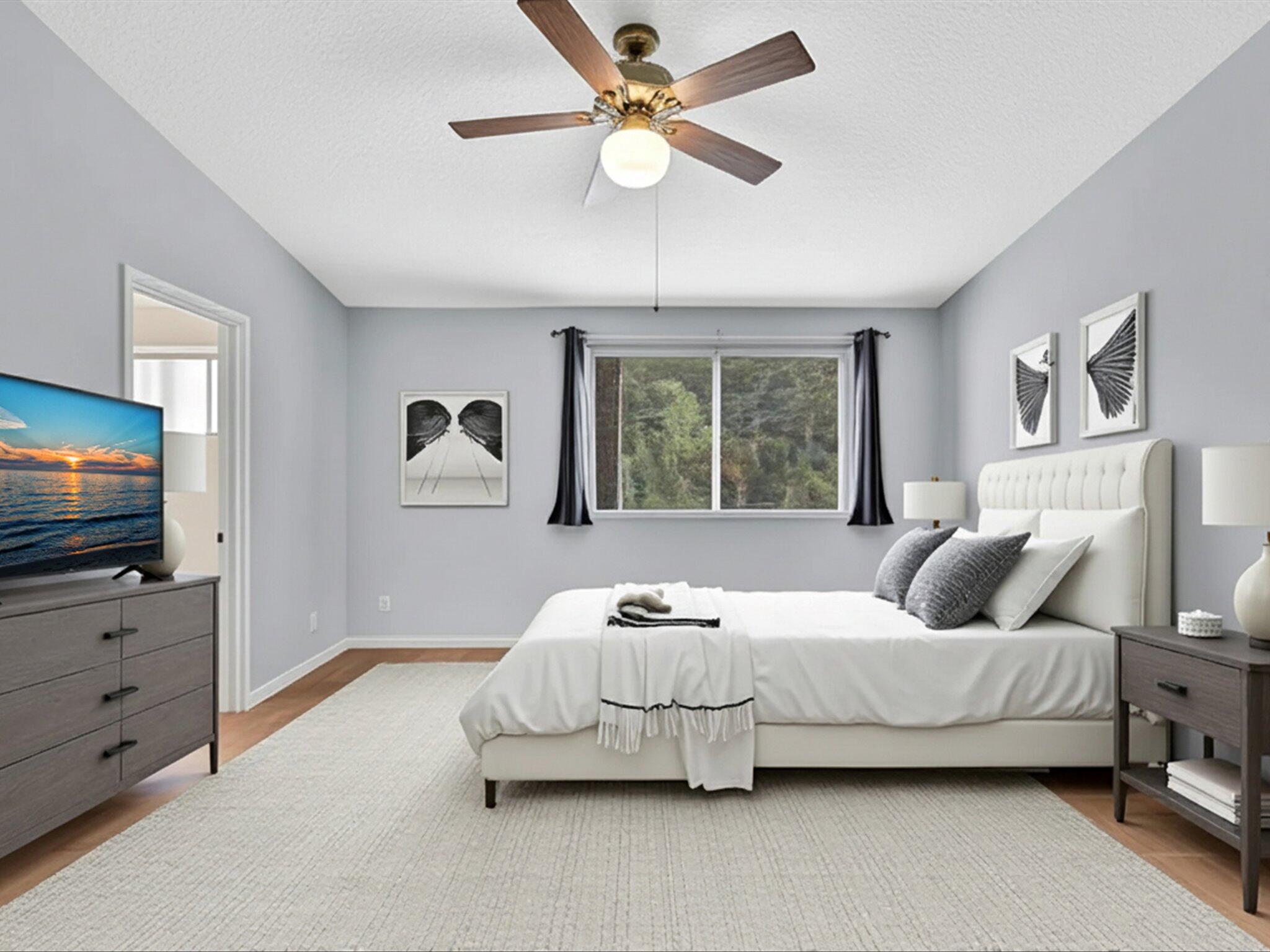 21018 Vía Eden, Unit 21018 Boca Raton, FL 33433 - Photo 16 of 63 a bedroom with a bed and a flat screen tv