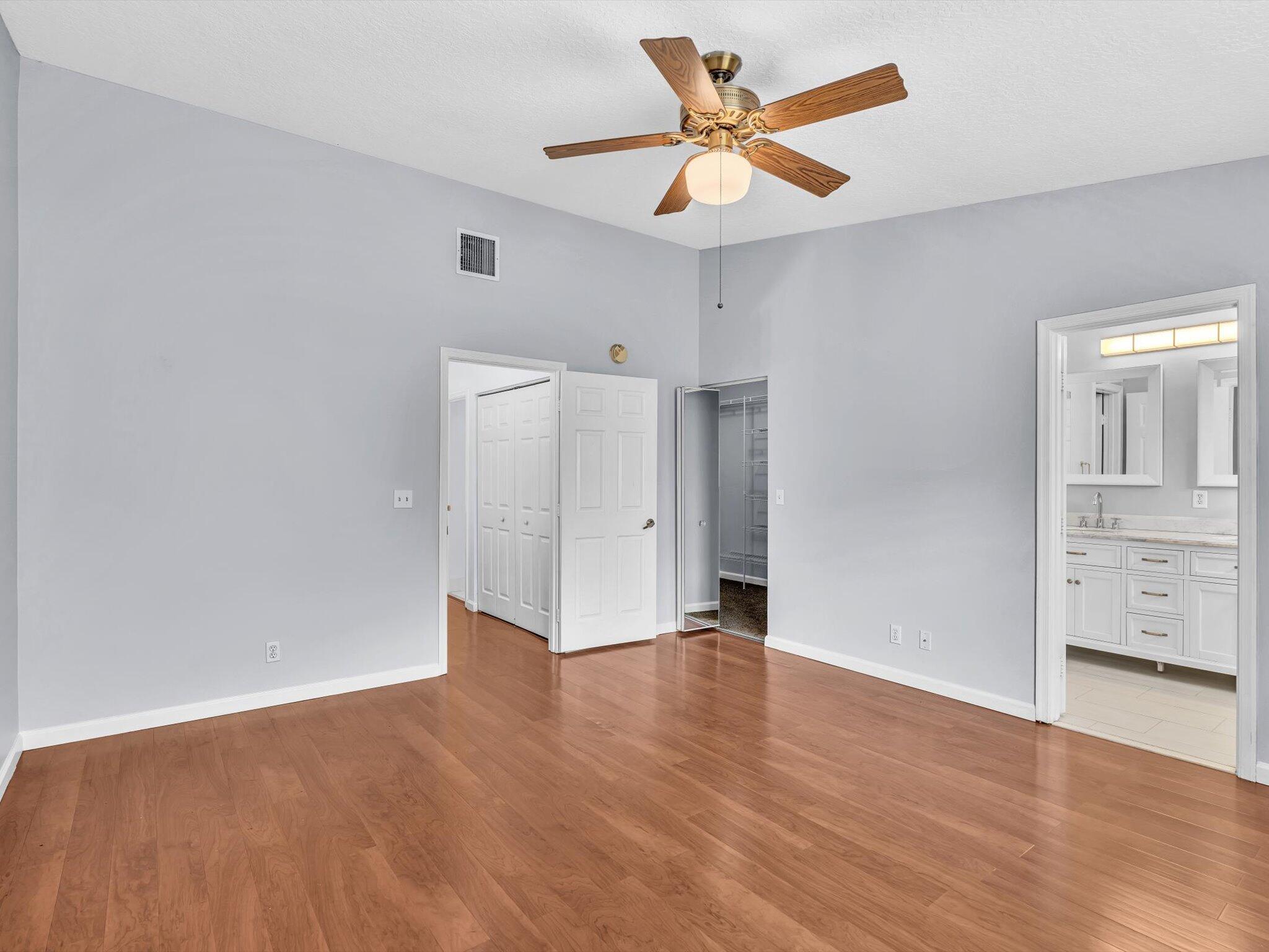 21018 Vía Eden, Unit 21018 Boca Raton, FL 33433 - Photo 17 of 63 wooden floor in an empty room with a window