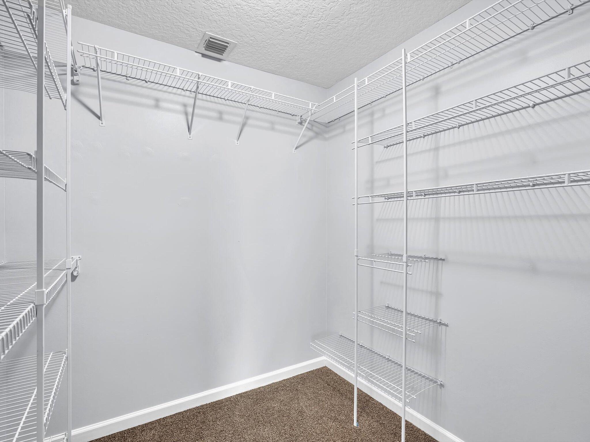 21018 Vía Eden, Unit 21018 Boca Raton, FL 33433 - Photo 18 of 63 a view of a room with racks on the wall