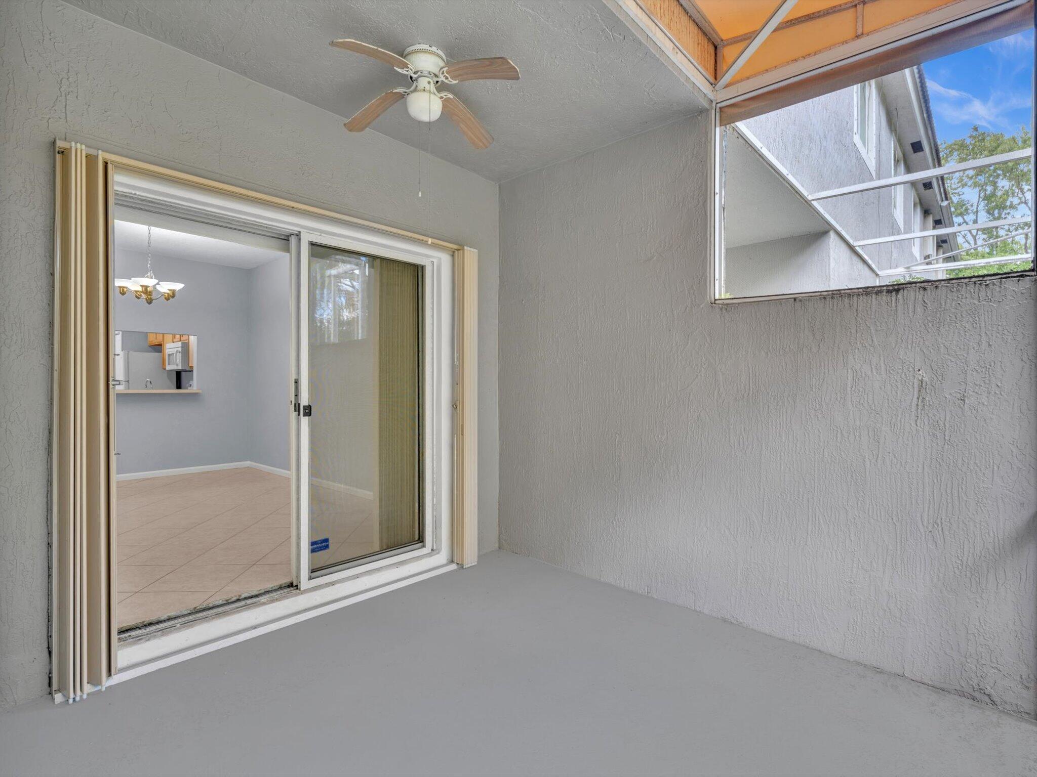 21018 Vía Eden, Unit 21018 Boca Raton, FL 33433 - Photo 29 of 63 an empty room with a mirror and door