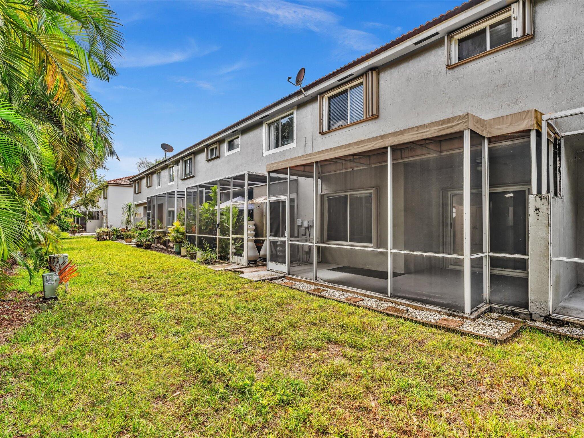 21018 Vía Eden, Unit 21018 Boca Raton, FL 33433 - Photo 31 of 63 a view of a house with a swimming pool
