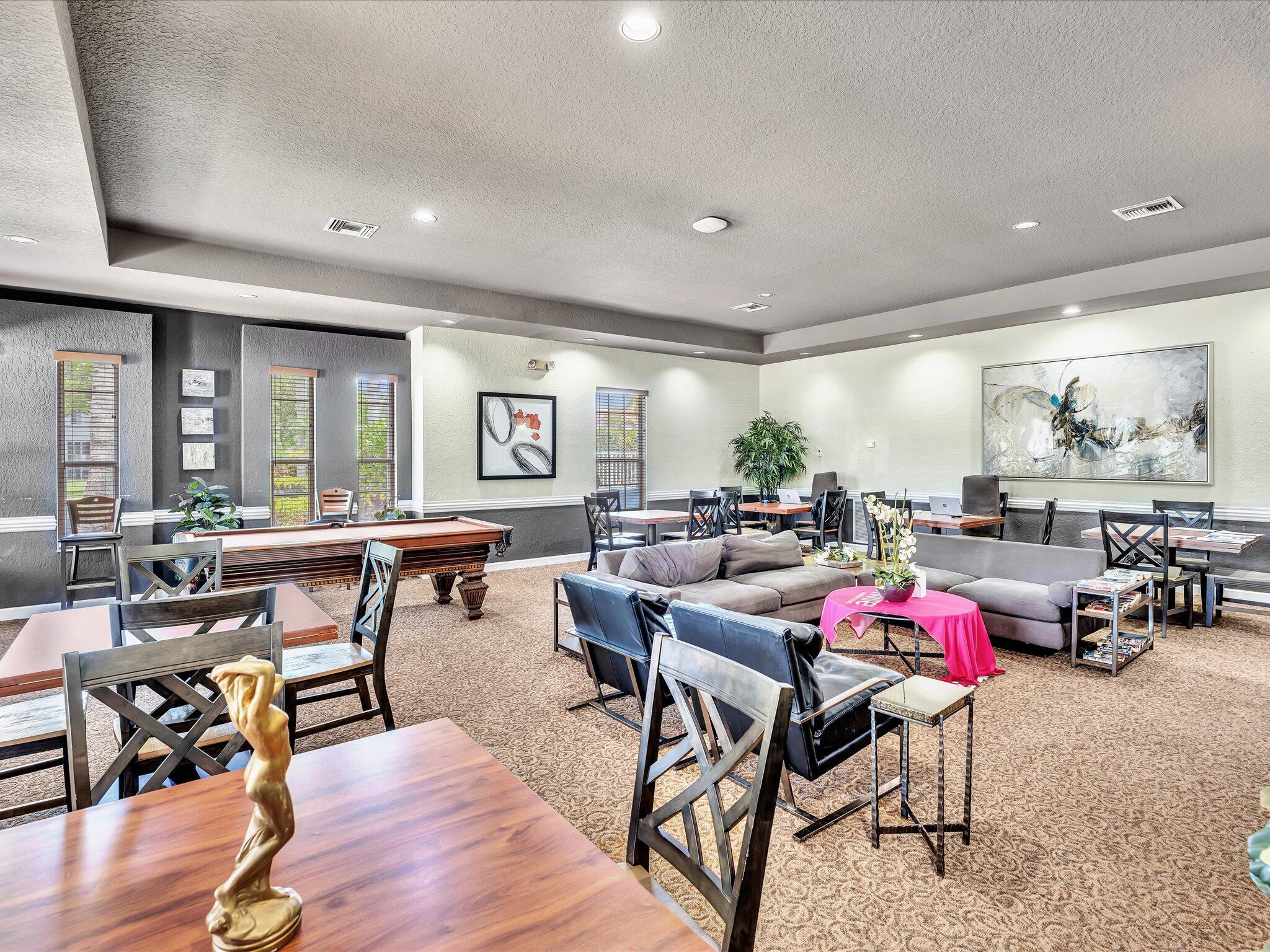 21018 Vía Eden, Unit 21018 Boca Raton, FL 33433 - Photo 42 of 63 a room with lots of furniture and view of dining room