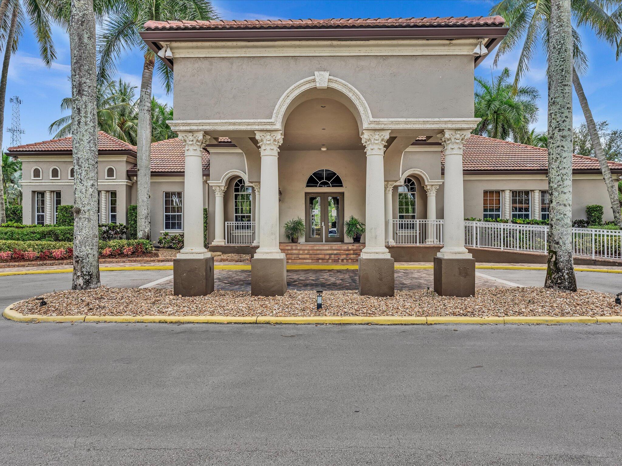 21018 Vía Eden, Unit 21018 Boca Raton, FL 33433 - Photo 48 of 63 a front view of a house with garden