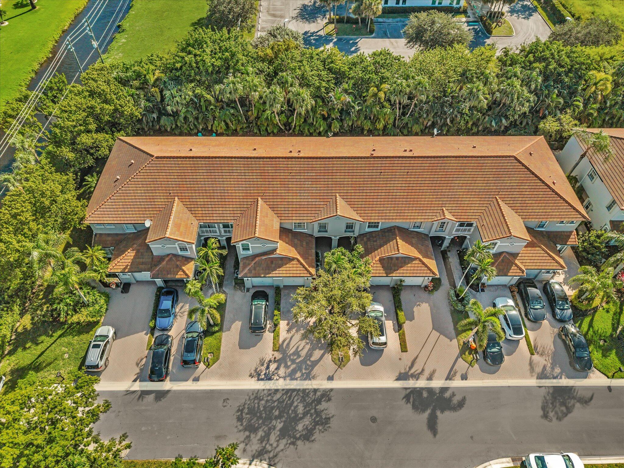 21018 Vía Eden, Unit 21018 Boca Raton, FL 33433 - Photo 58 of 63 an aerial view of a house having yard